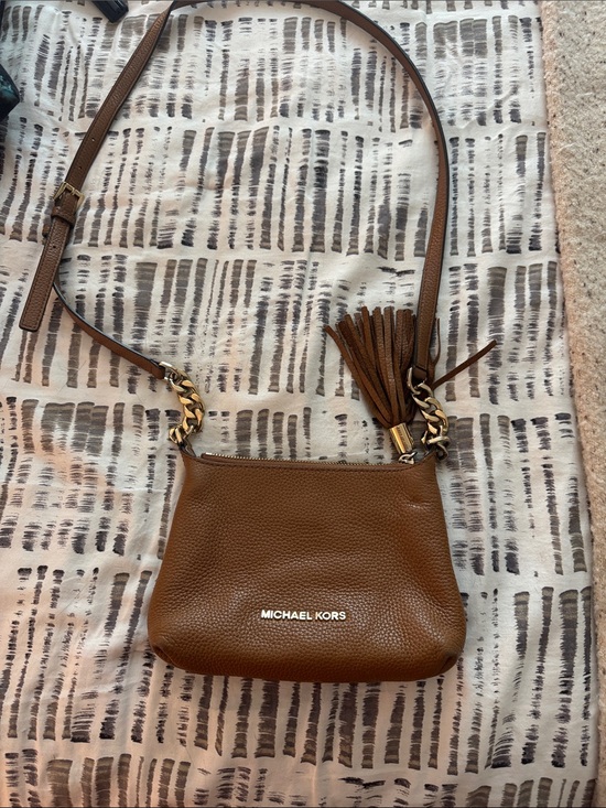 Michael Kors Handbags - Michael Kors Brown Pebbled Leather Crossbody with Tassel Detail